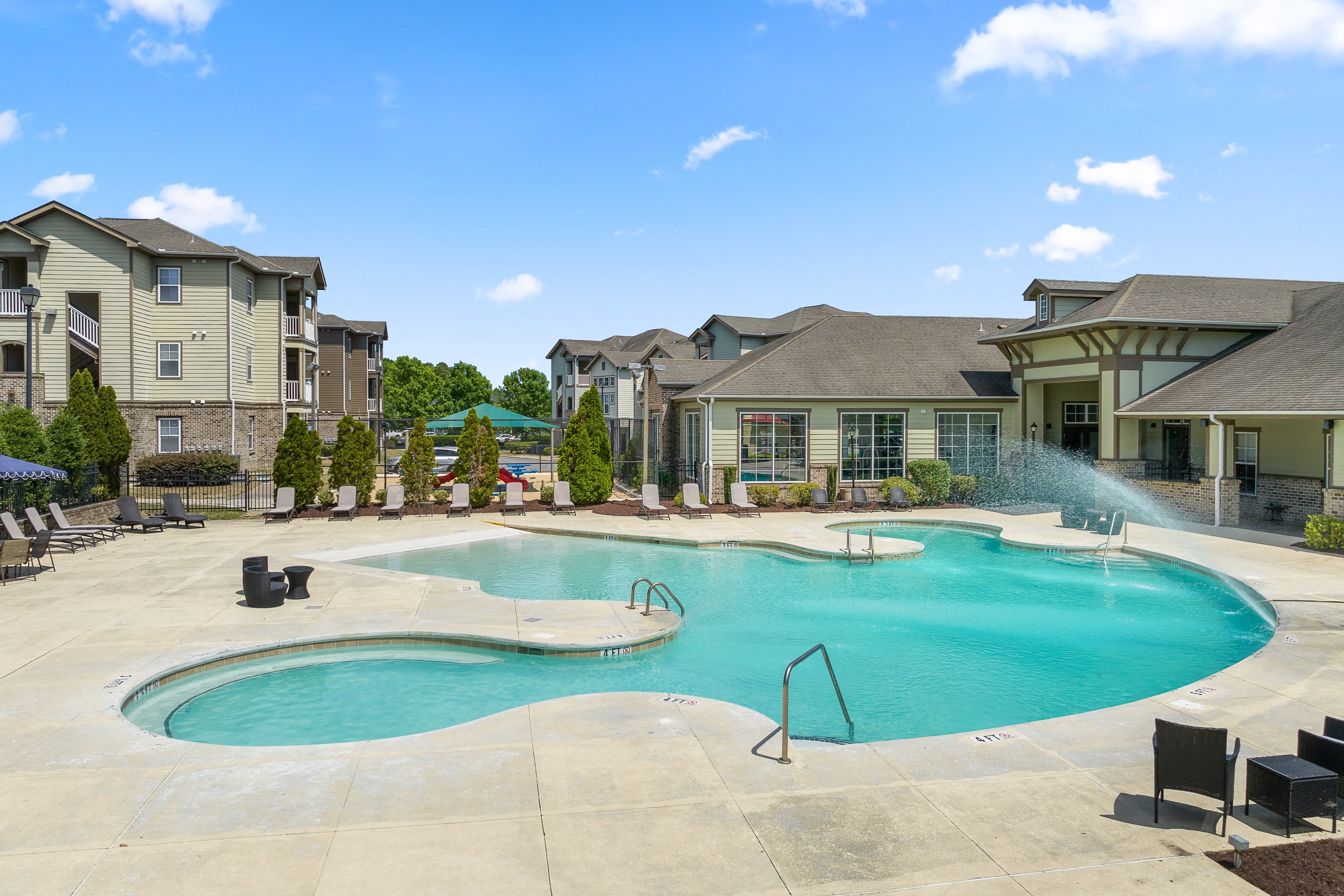 our apartments have a large swimming pool with a fountain